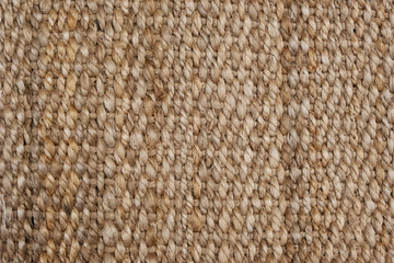 A fragment of a wicker basket made of plaits of natural origin. Ideal for wallpapers, backgrounds...