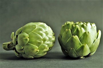 Obraz premium Pair of artichokes front and back photo isolate on black