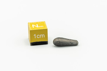 Black magnetic Atacaimite Tektite Meteorite isolated, a rock formed in a big meteorite collision at...