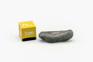 Black magnetic Atacaimite Tektite Meteorite isolated, a rock formed in a big meteorite collision at...