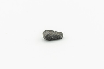 Black magnetic Atacaimite Tektite Meteorite isolated, a rock formed in a big meteorite collision at...
