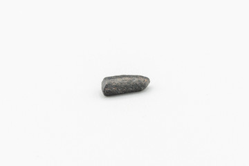 Black magnetic Atacaimite Tektite Meteorite isolated, a rock formed in a big meteorite collision at...