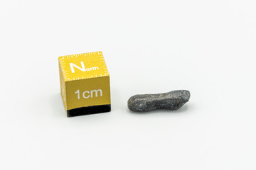 Black magnetic Atacaimite Tektite Meteorite isolated, a rock formed in a big meteorite collision at...