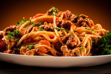 Spaghetti with meat, tomato sauce and vegetables