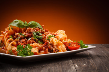 Pasta with meat, tomato sauce and vegetables