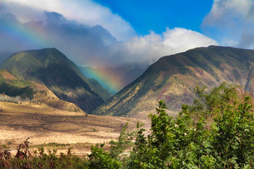 Unique rainbow over the west Maui montains in Lahaina.