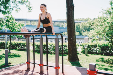 Fototapeta premium Strong female working on abs at sport ground