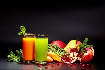 Glasses with fresh vegetable juices isolated on Black. Detox diet.