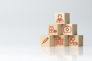 Medical health insurance concept using wood block with medical healthcare icons