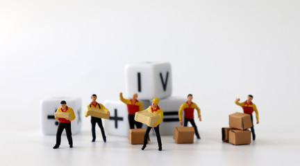Miniature courier drivers and white cubes with an arithmetic operation symbol.