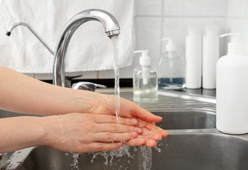 Woman washing hands with antibacterial soap and water. Hygiene concept. Coronavirus protection hand...