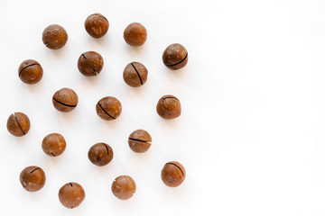 Macadamia nuts in the shell isolated on a white background close-up.