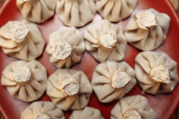 cooked khinkali on a clay plate