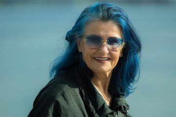 portrait of woman with dyed hair in sunglasses  - 331105349