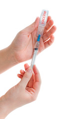 Ampoule with vaccine from a new coronavirus and syringe in a woman hand isolated on white background. Flu vaccination concept. COVID-19. 2019 Novel Coronavirus 2019-nCoV concept