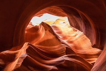 Unique & stunning Antelope Canyon located near Page, Arizona. Looking up into the famous tourist area during summer time with sun shining down through canyon walls