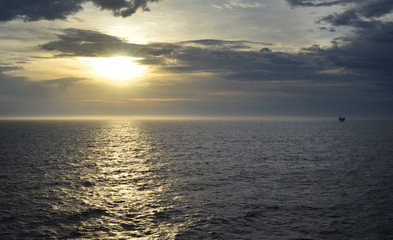  horizon on Bass Strait Australia with distant platform at dusk