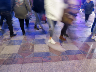people walking on a pedestrian street at night