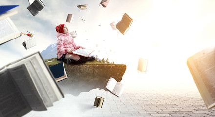 Little girl reading a book