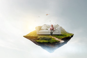 Dreamy little girl sitting ready for adventure