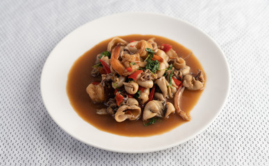 Stir fried basil with squid and shrimp, seafood style Thai food.