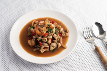 Stir fried basil with squid and shrimp, seafood style Thai food.