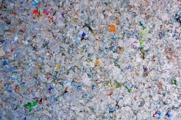 Abstract texture and multicolored of heat resistant gypsum board background made of pasteurized milk carton box, recycle and reuse for wall and ceiling materials in home decoration design concept