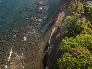 Dauin protected house reef and black volcanic beach