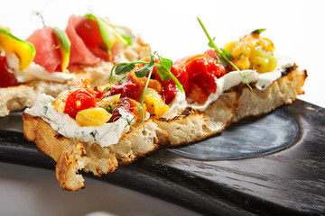 Bruschetta with baked peppers closeup view