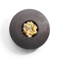Scallop with green buckwheat top view