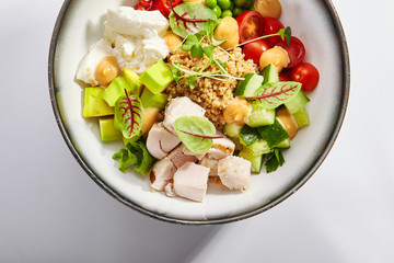 Couscous with chiken and avocado top view