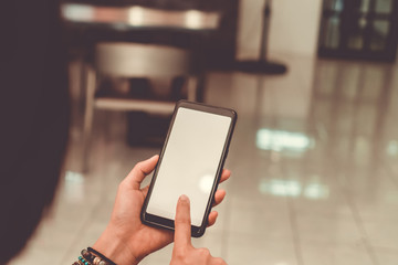 Woman hand use smartphone to do work business, social network, communication in public.
