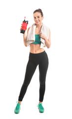 Sporty young woman with protein shake on white background