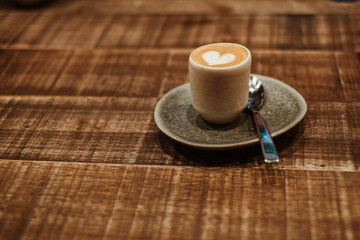 Coffee - piccolo style - on a wooden table