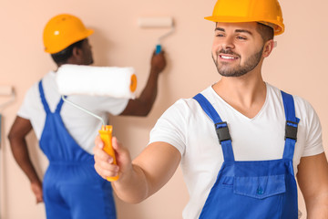 Painters doing repair in room