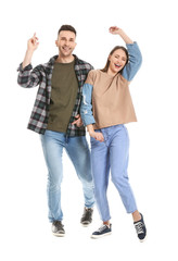 Obraz premium Young couple dancing against white background