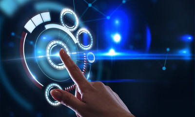 Business, technology, internet and networking concept. Young businessman working in the office, select the icon on the virtual display.