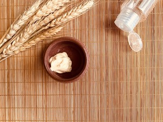 Authentic face treatment tools on bamboo.