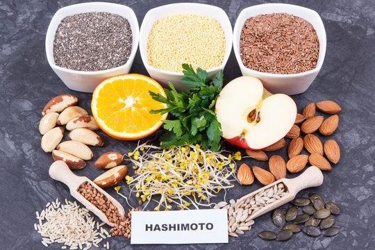 Inscription hashimoto with products and ingredients containing vitamins for healthy thyroid
