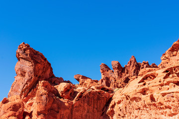 Fantastic aztec sandstone rock formations in the Valley of Fire state park under beautiful blue sky