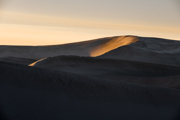 first light on sand dunes
