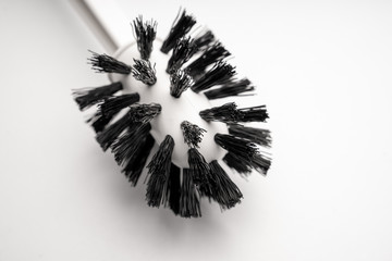 a toilet brush on a white background. close-up.