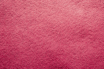 Red felt soft rough textile material background texture close up. Colorful felt texture for background with copy space. Felt fabric sheet