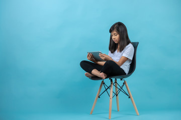 little girl smiling with tablet 