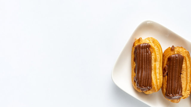 part cakes chocolate icing on white background