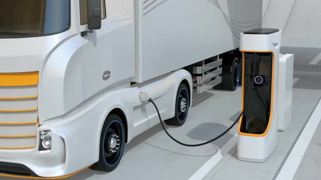 Generic design blue Heavy Electric Trucks charging at Public Charging Station. The charging station equipped  with roof-mounted solar panels. 3D rendering animation.