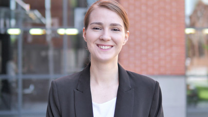 Outdoor Portrait of Smiling Young Businesswoman