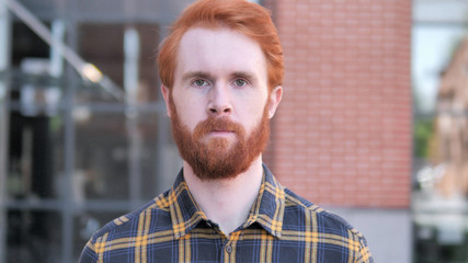 Outdoor Portrait of Redhead Beard Young Man