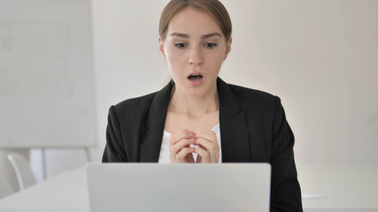 Close Up of Shocked Young Businesswoman Wondering at Work