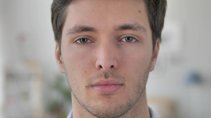 Face Close Up of Serious Handsome Young Man